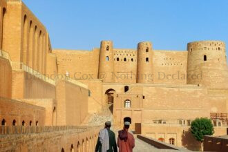 two brothers walk in Herat Citadel, Afghanistan