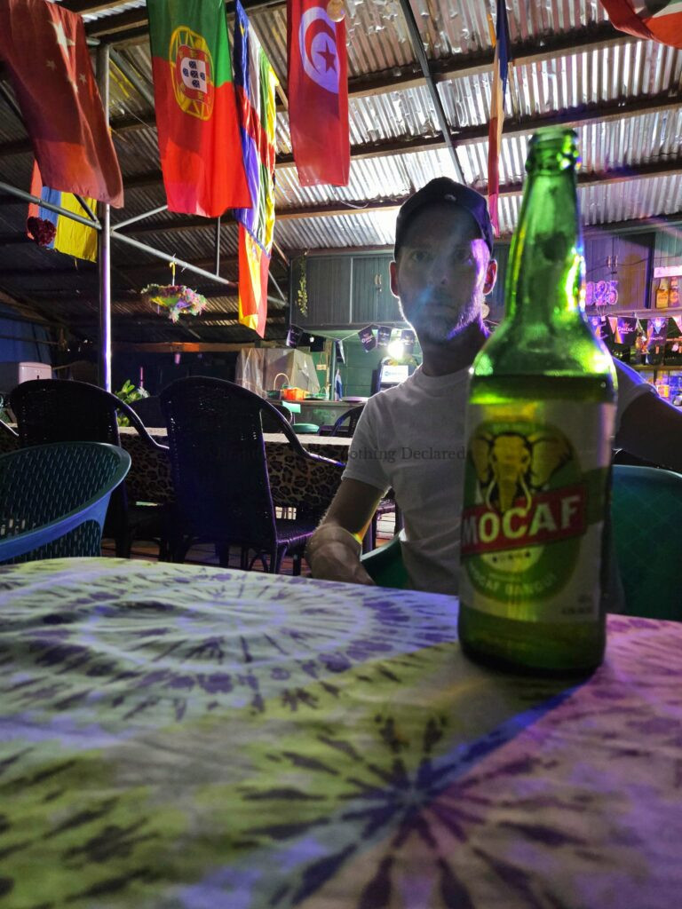 having a beer on the Ubangi River, Bangui, Central African Republic