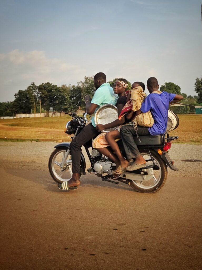 4 people on a bike is a normal sight in Central African Republic
